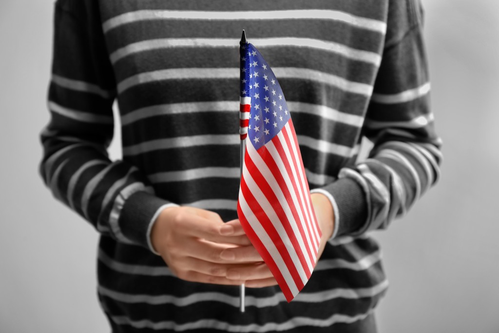 holding a US Flag